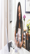 woman holding breast pump while working