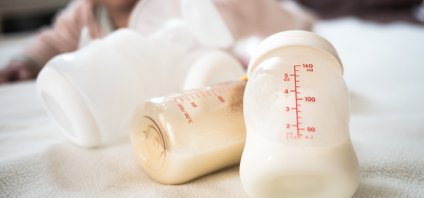 breast milk in storage bottles on counter