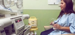 woman sitting on chair and breast pumping for her baby in the nicu