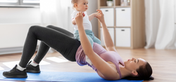 Woman doing pelvic exercise, holding her baby